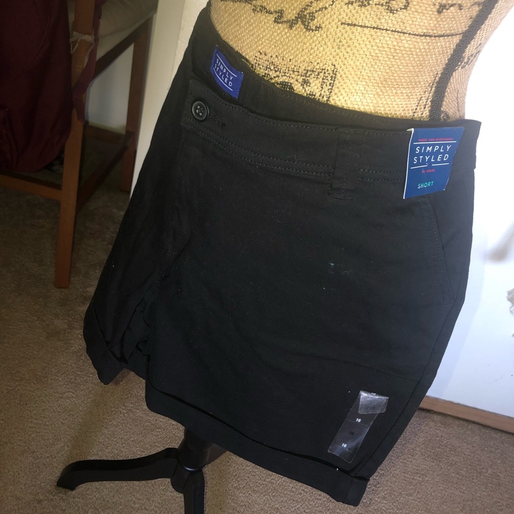 Khaki and black shorts
